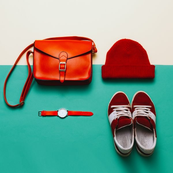 Stylish accessories and clothing. Focus on red. Handbags, caps, watches. Sneakers. Urban style